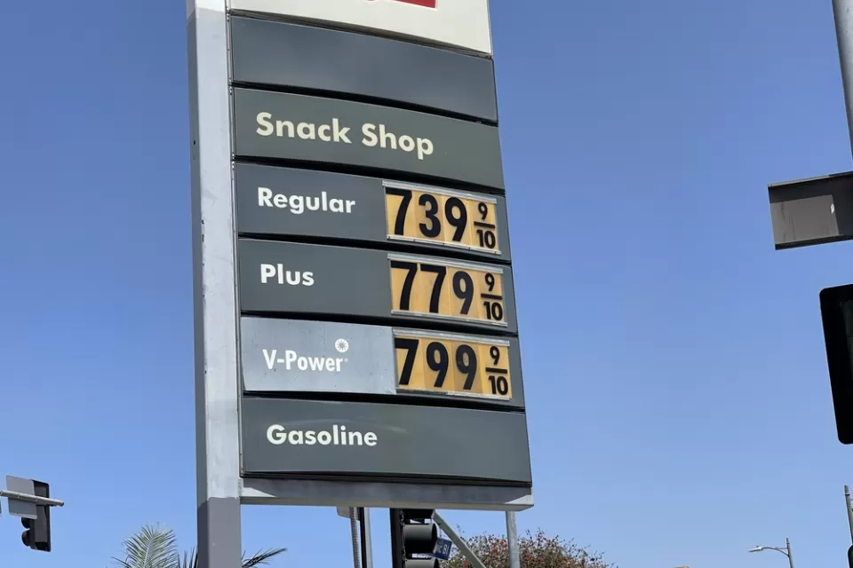 A sign with gas prices all listed above $7.39 per gallon.